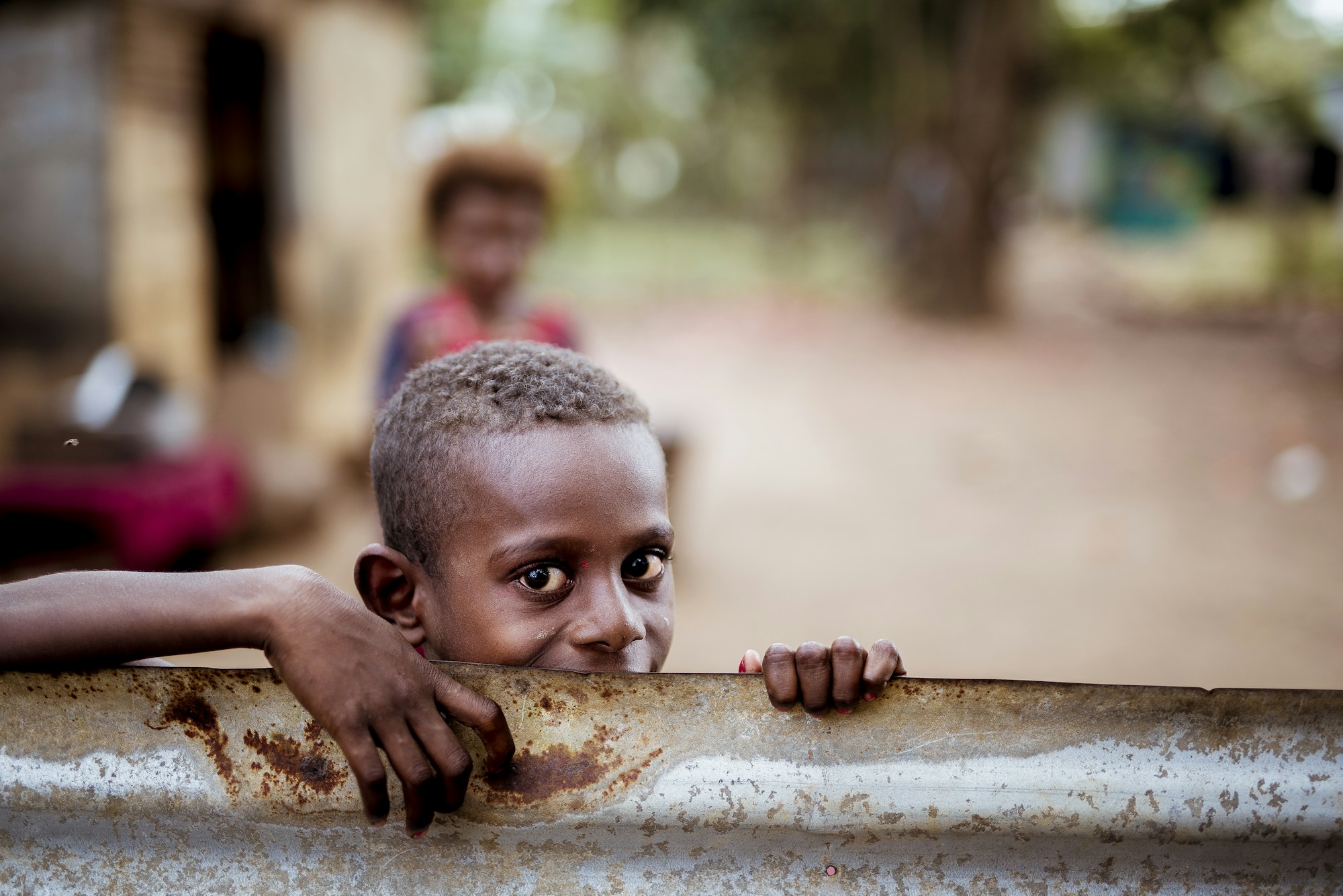 Image of a child looking at the camera